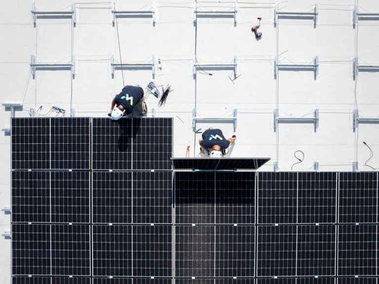 A man installing solar panels