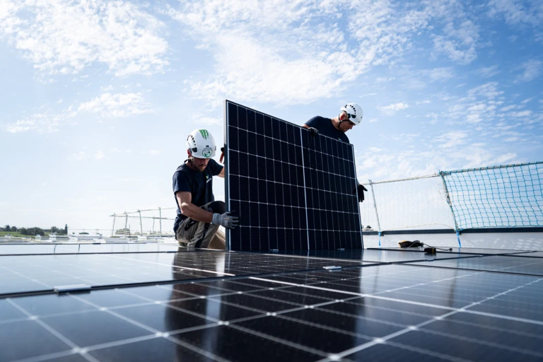 A man installing solar panels