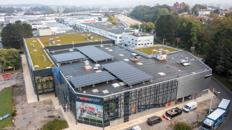 A company that has installed solar panels on its roof