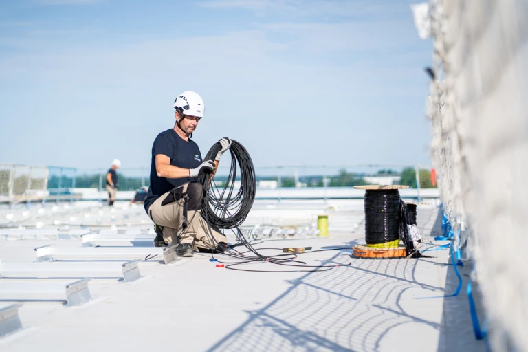 A man installing solar panels